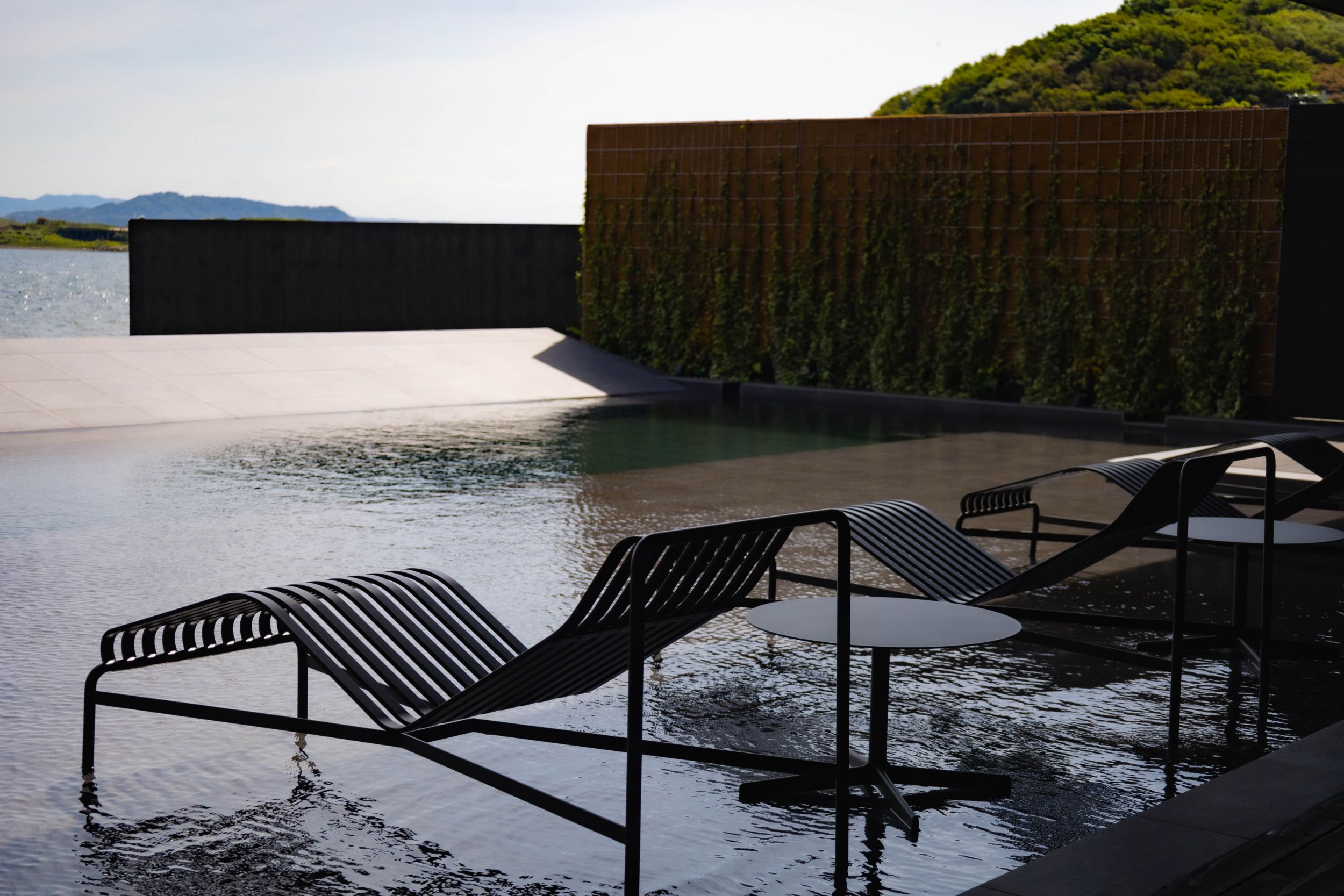 Black-tiled infinity pool and terrace